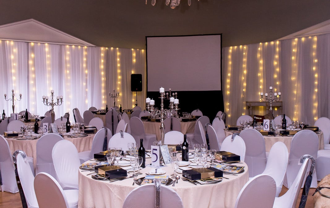 World Sight Gala Dinner at Kelvin Grove, Cape Town, featuring white draping with warm fairy lights by The Events Draping Co. for the South African Guide Dog Association fundraiser.