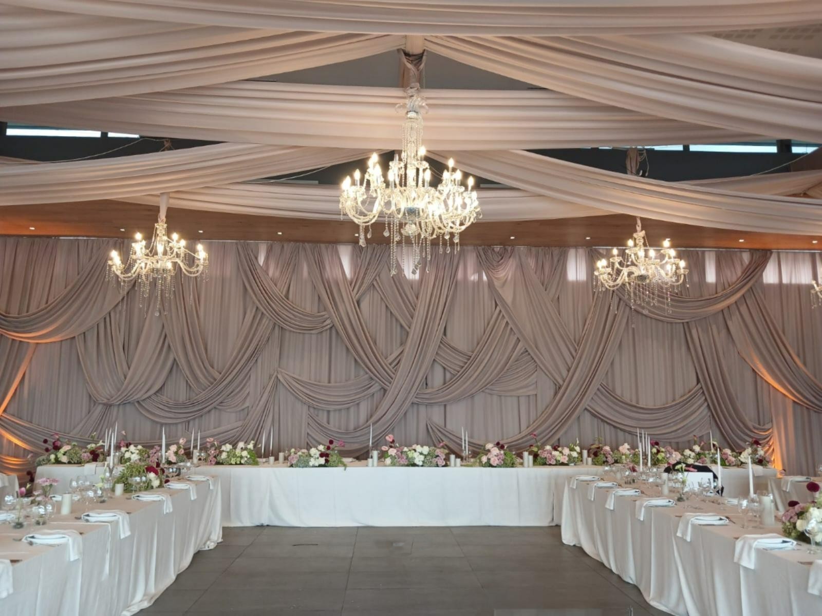     Taupe wall draping with overdrapes by The Events Draping Co.