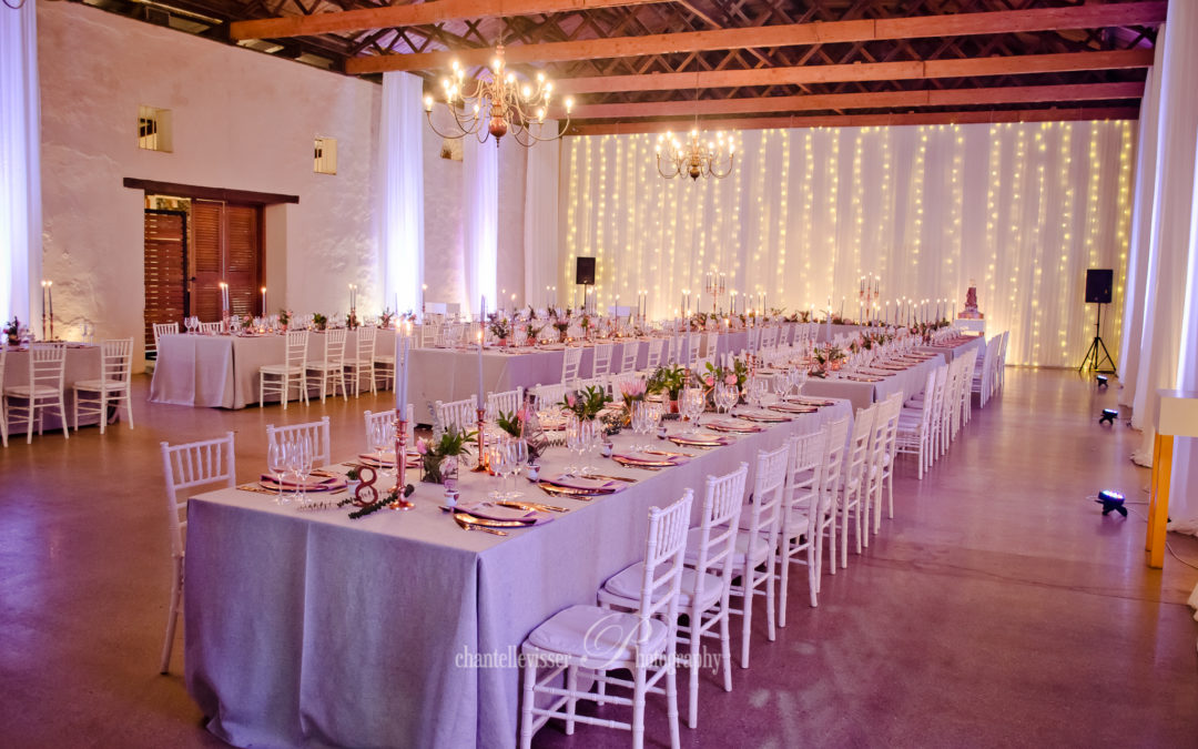 Wedding setup at Nooitgedacht in the Cape Winelands, featuring sophisticated draping by The Events Draping Co.