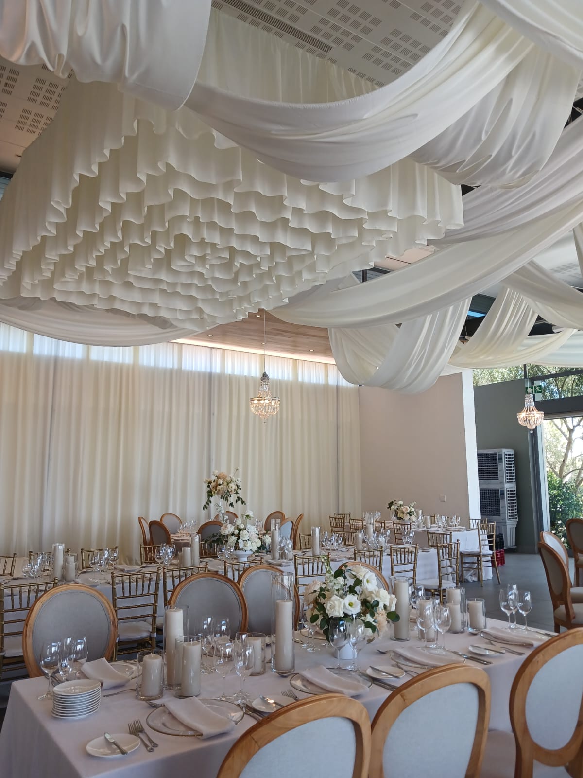 Layered ceiling draping with swags by The Eevents Draping Co.