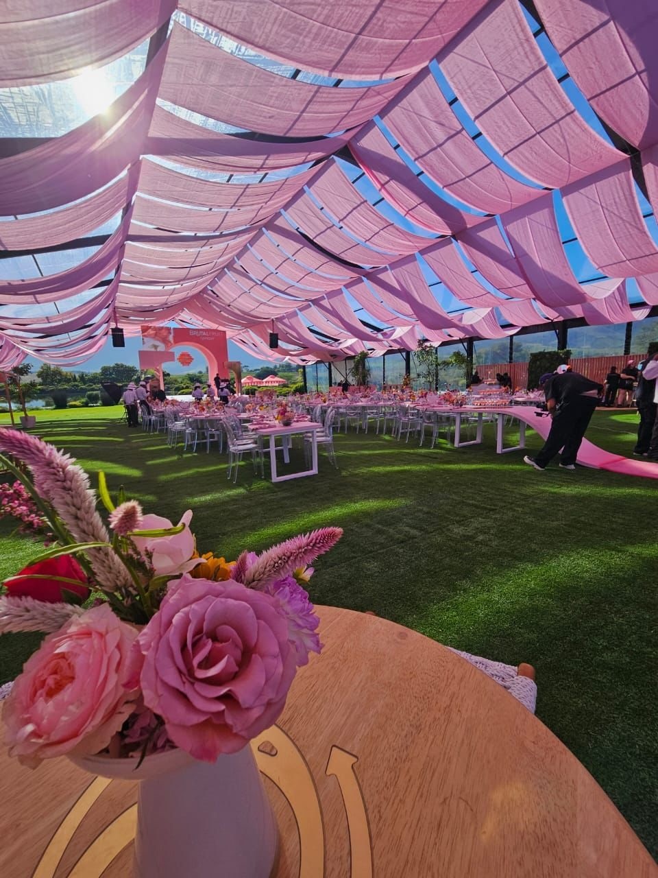 Off-white wall drapings with overdrapes by The Events Draping Co.
