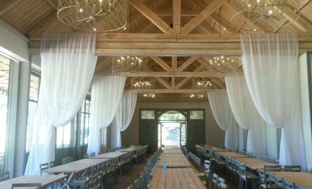 Wedding setup at The Olive Press, Boschendal Wine Estate, featuring stylish draping by The Events Draping Co.