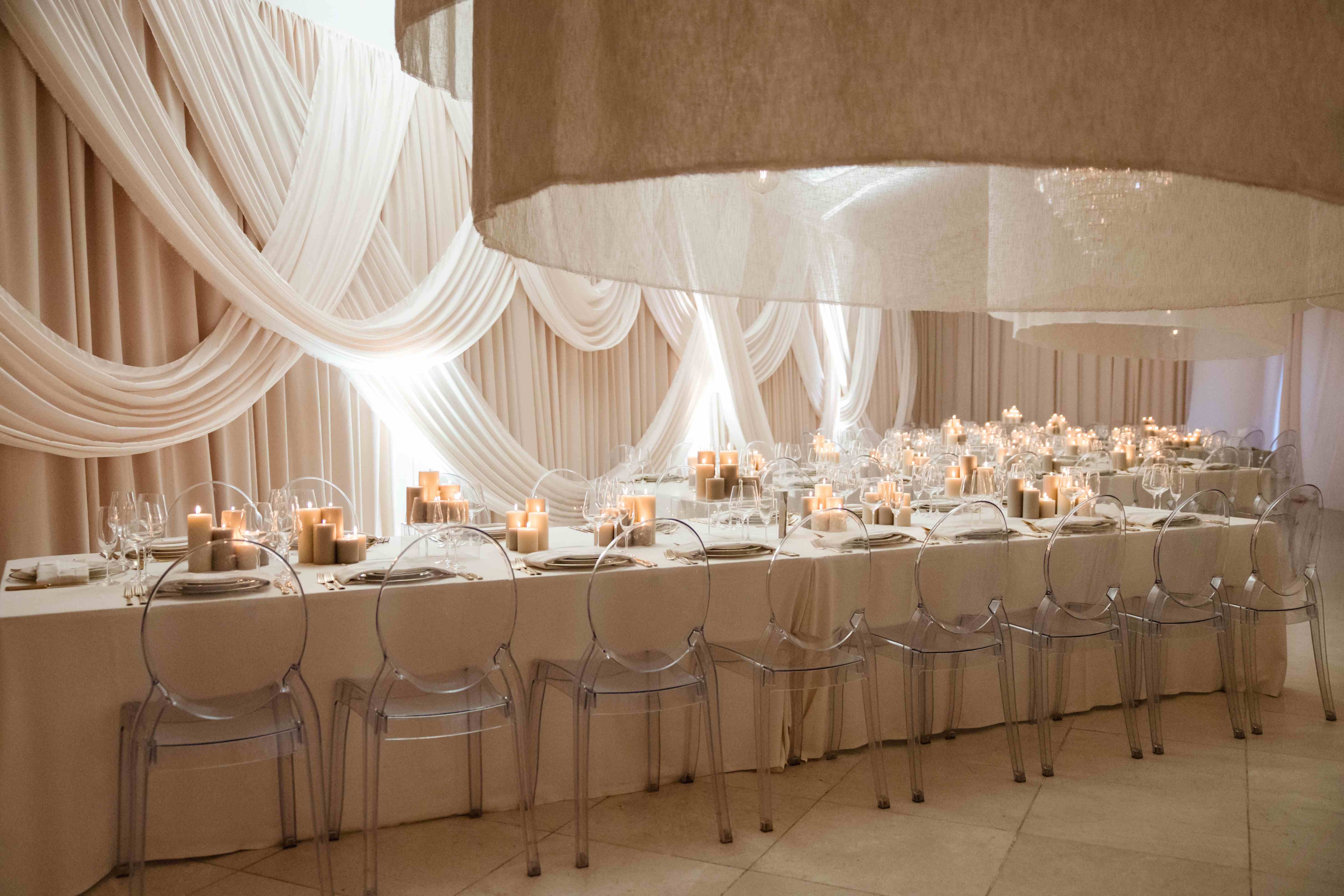 Bridal backdrop feature with overdrapes and pickups in white fabric