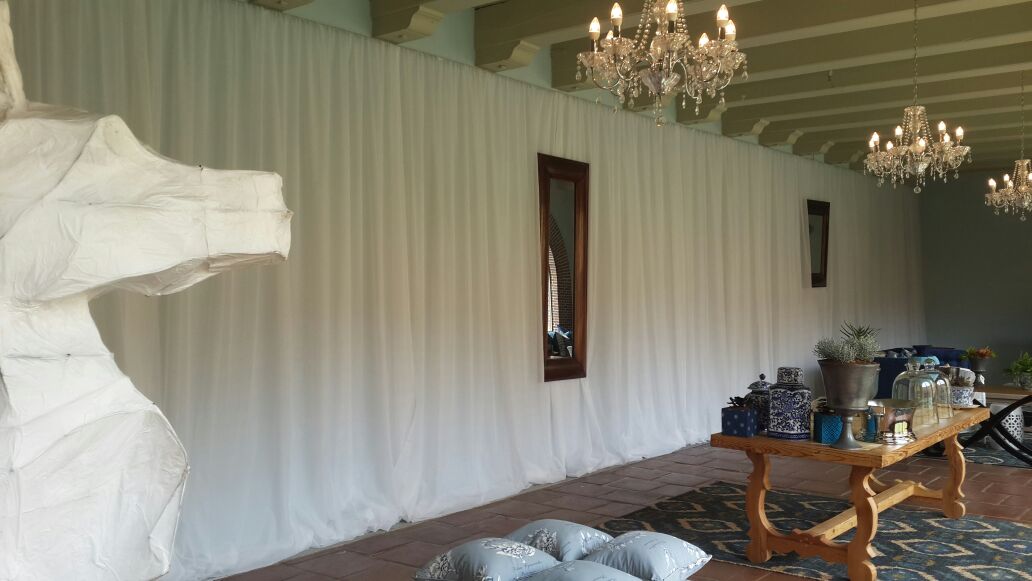 Event setup in the Dolphin Room at The Castle, Cape Town, featuring white voile fabric draping by The Events Draping Co.