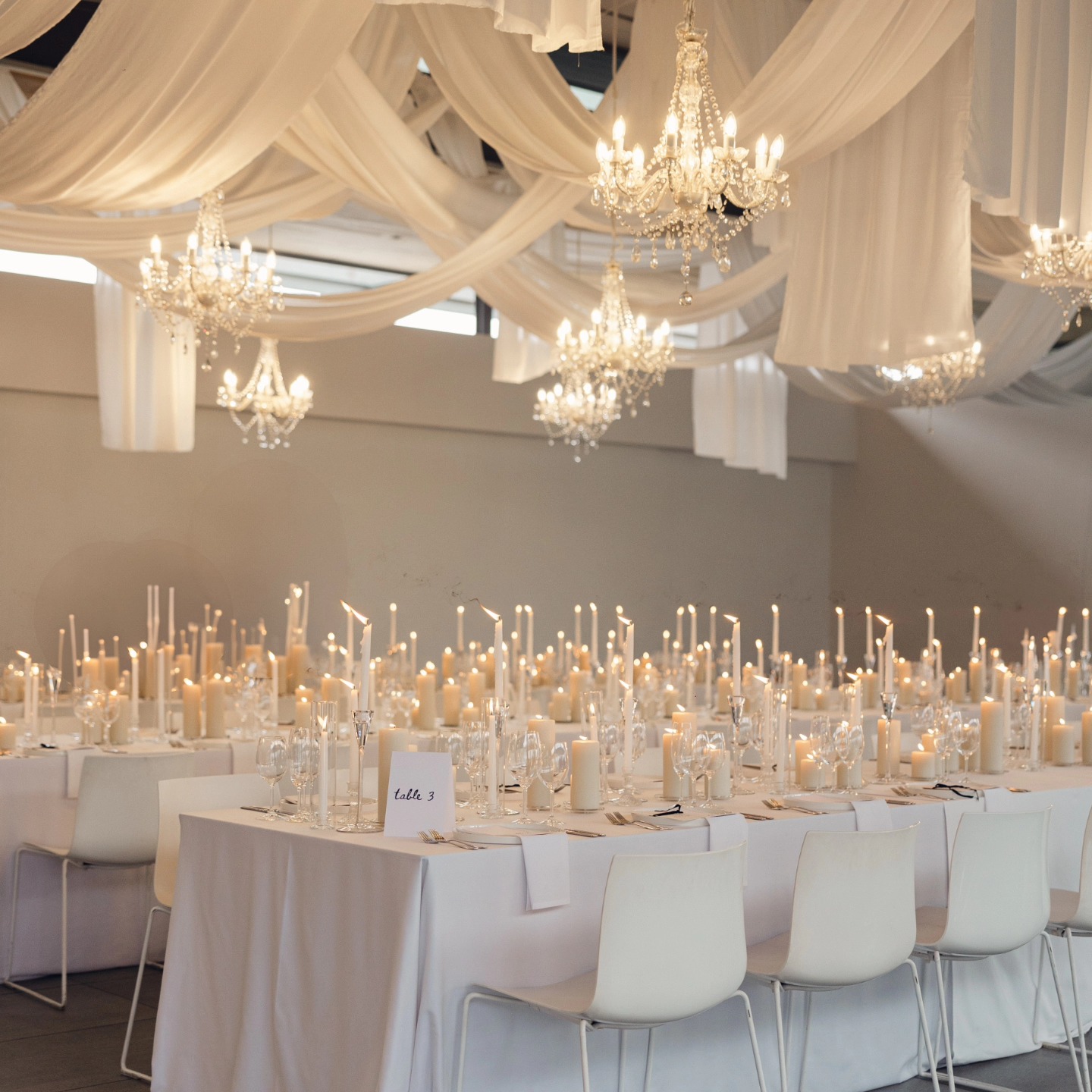 - Random ceiling swags and drops in white fabric