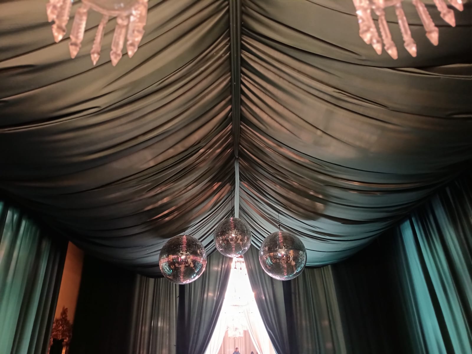 Swagged full ceiling draping in bottle green by The Events Draping Co.