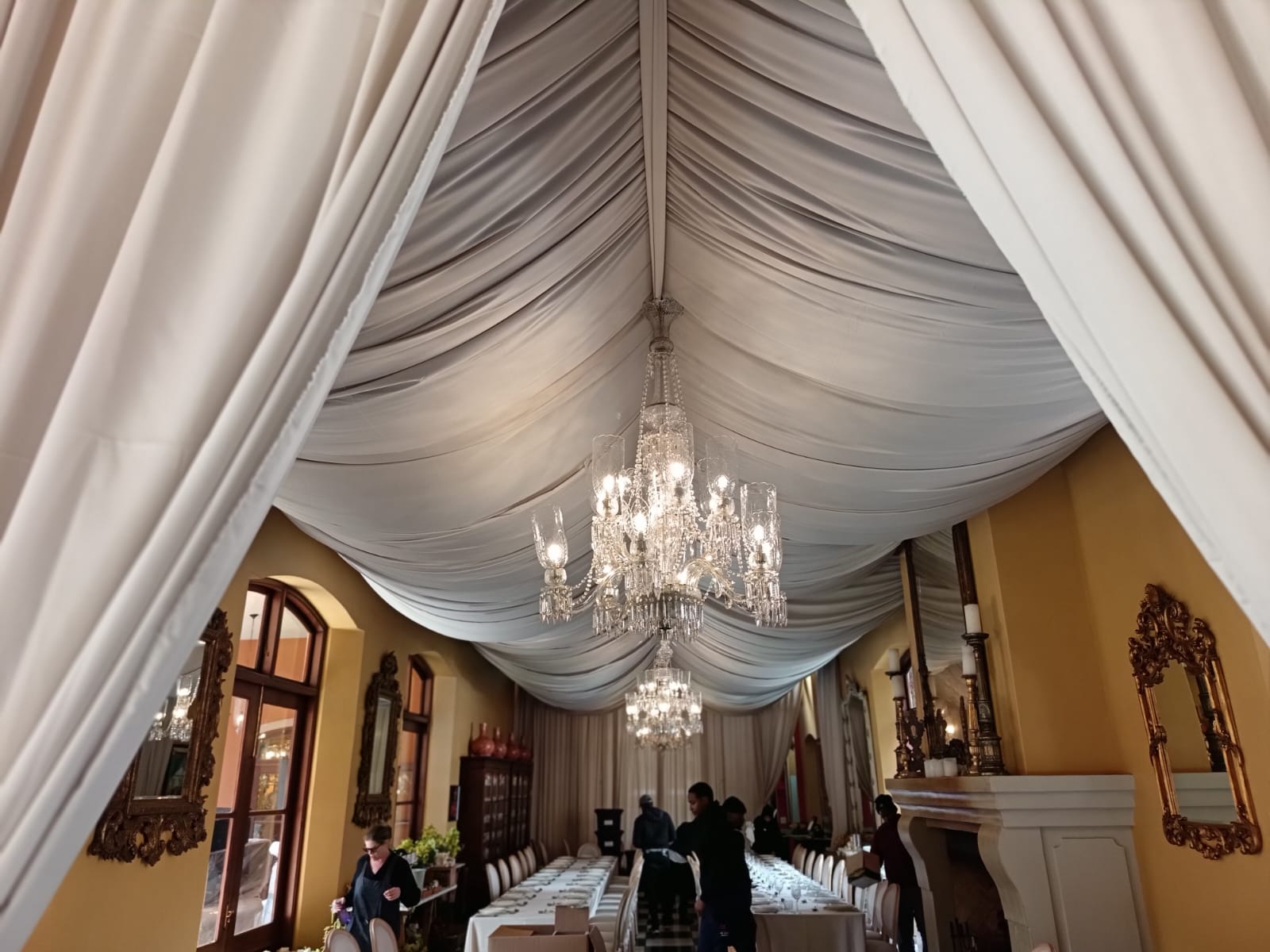 Swagged full ceiling draping in beige by The Events Draping Co.