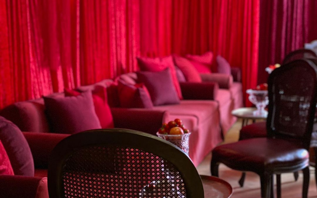 Photoshoot setup in Kloof Street, Cape Town, featuring vibrant red draping by The Events Draping Co.