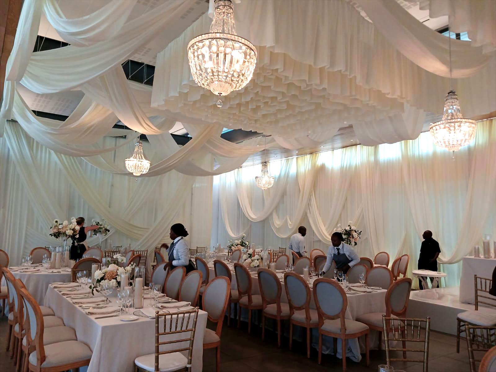 Dramatic multi- coloured ceiling swags by The Events Draping Co.