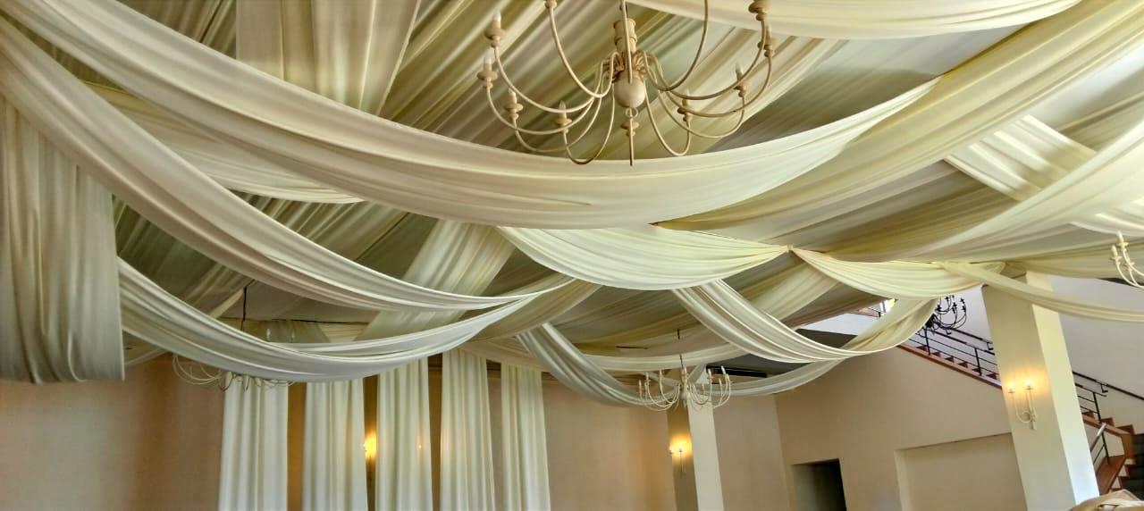 Random ceiling swags with wall drops by The Events Draping Co.