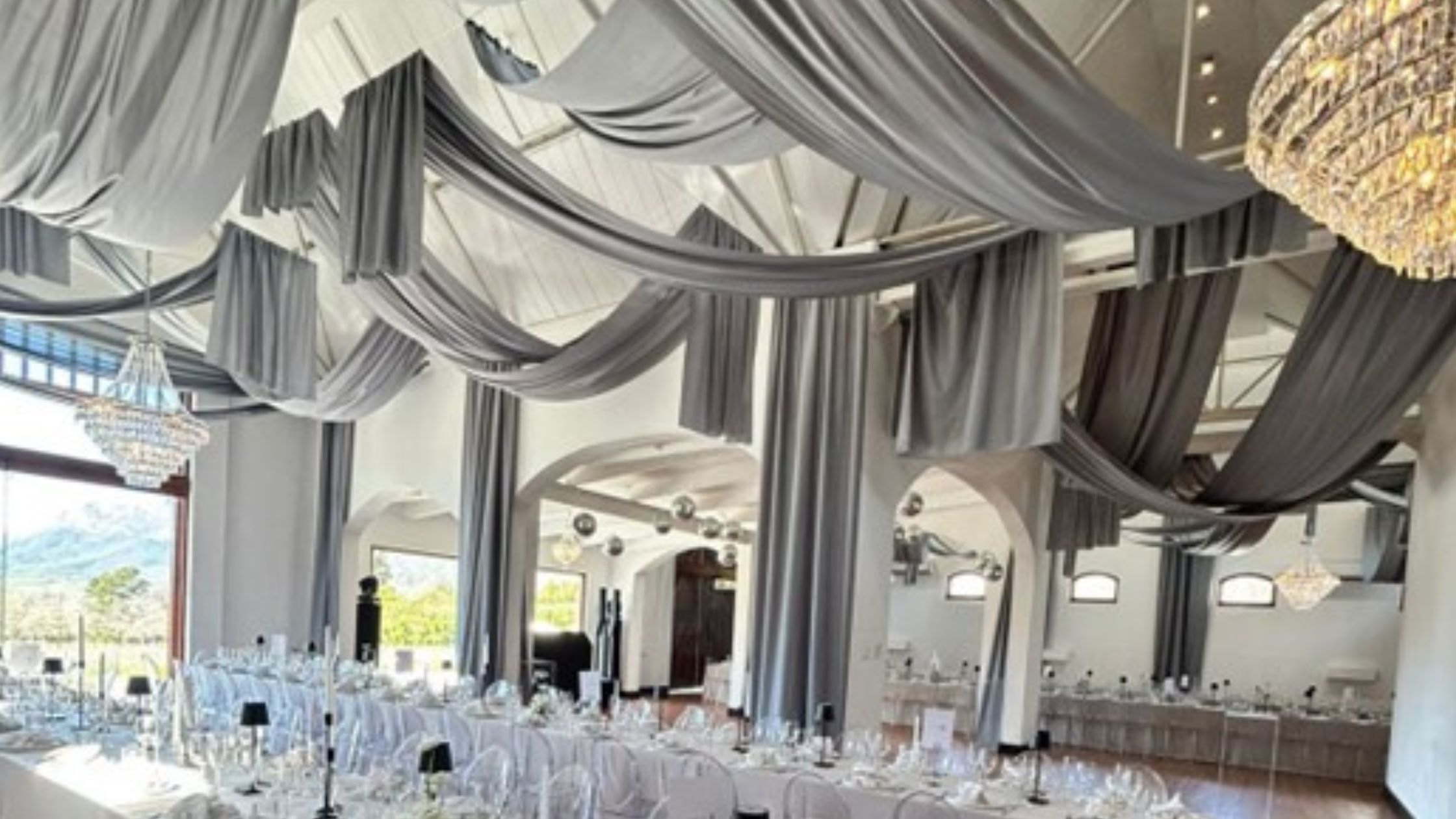 Wedding draping of dove grey random swags and drops by The Events Draping Co.
