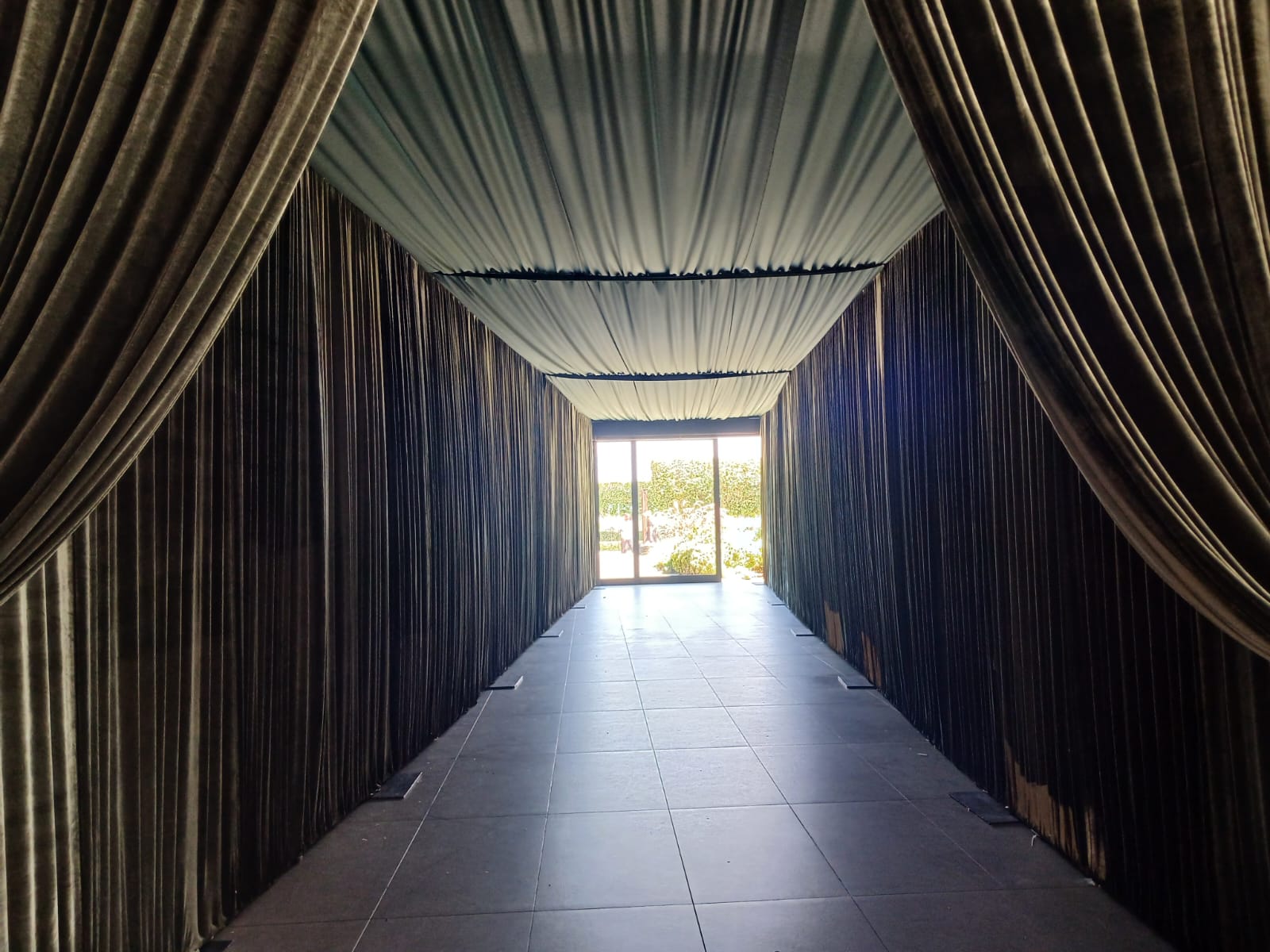 Wedding backdrop and full ceiling swags in white by The Events Draping Co.