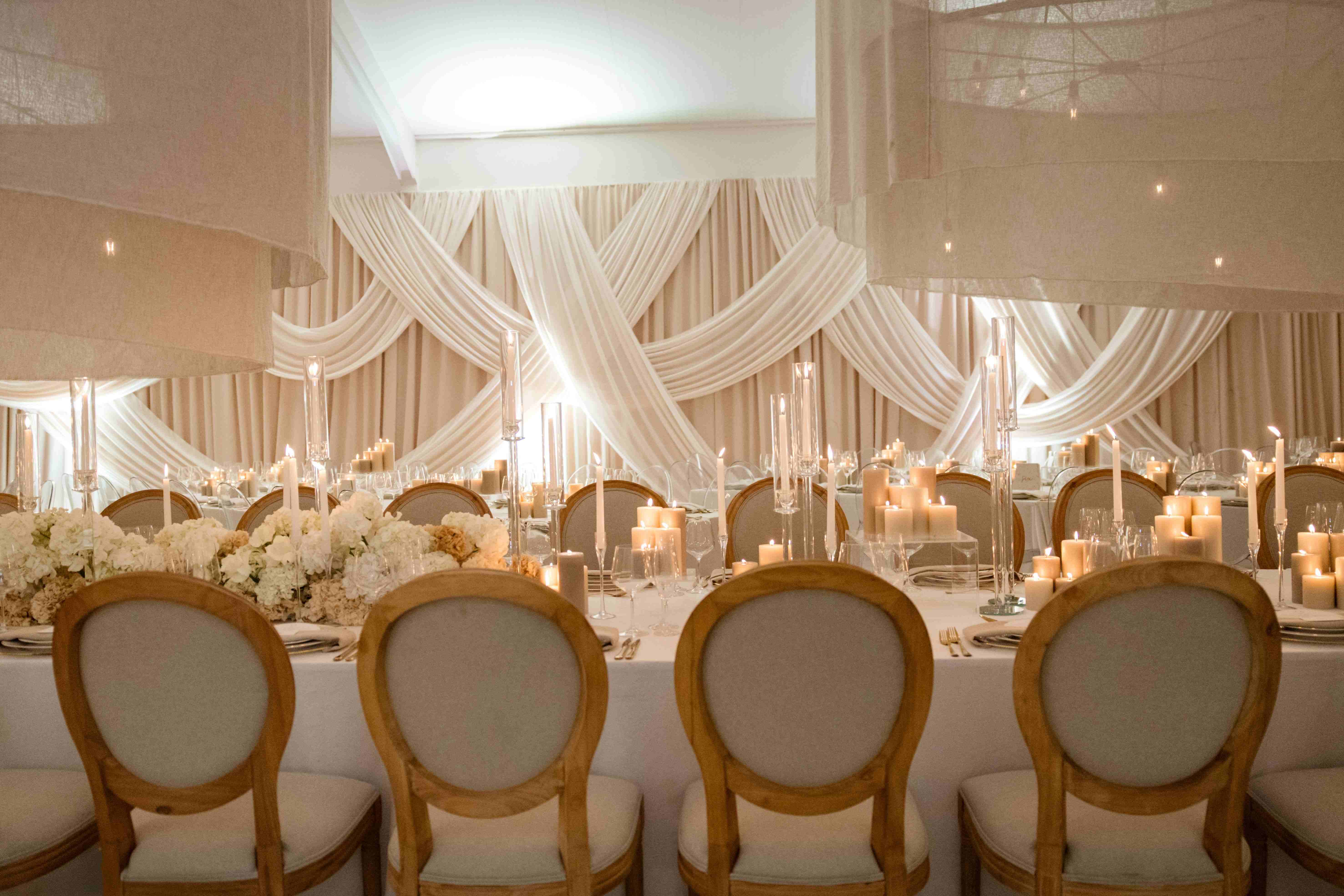 Wall draping in off-white with overdrapes