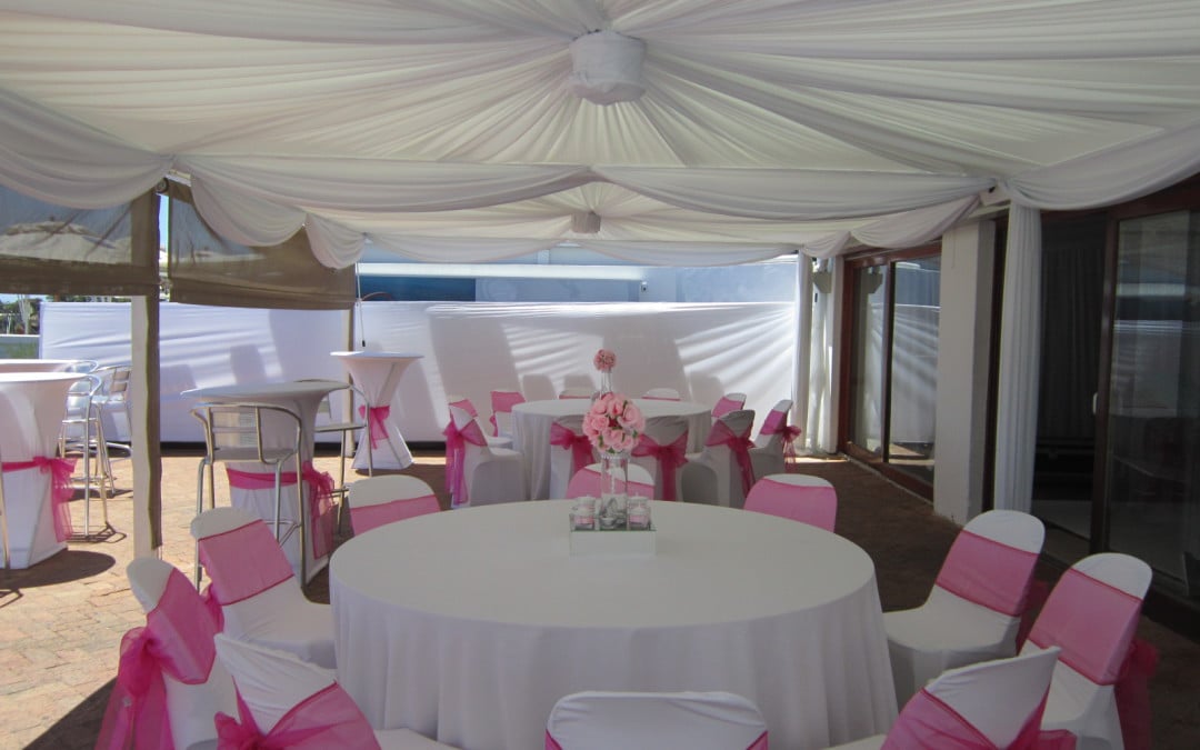 Year-end corporate party at The Glen Country Club, Clifton, featuring white ceiling-to-floor draping with swags and white draped pillars by The Events Draping Co.