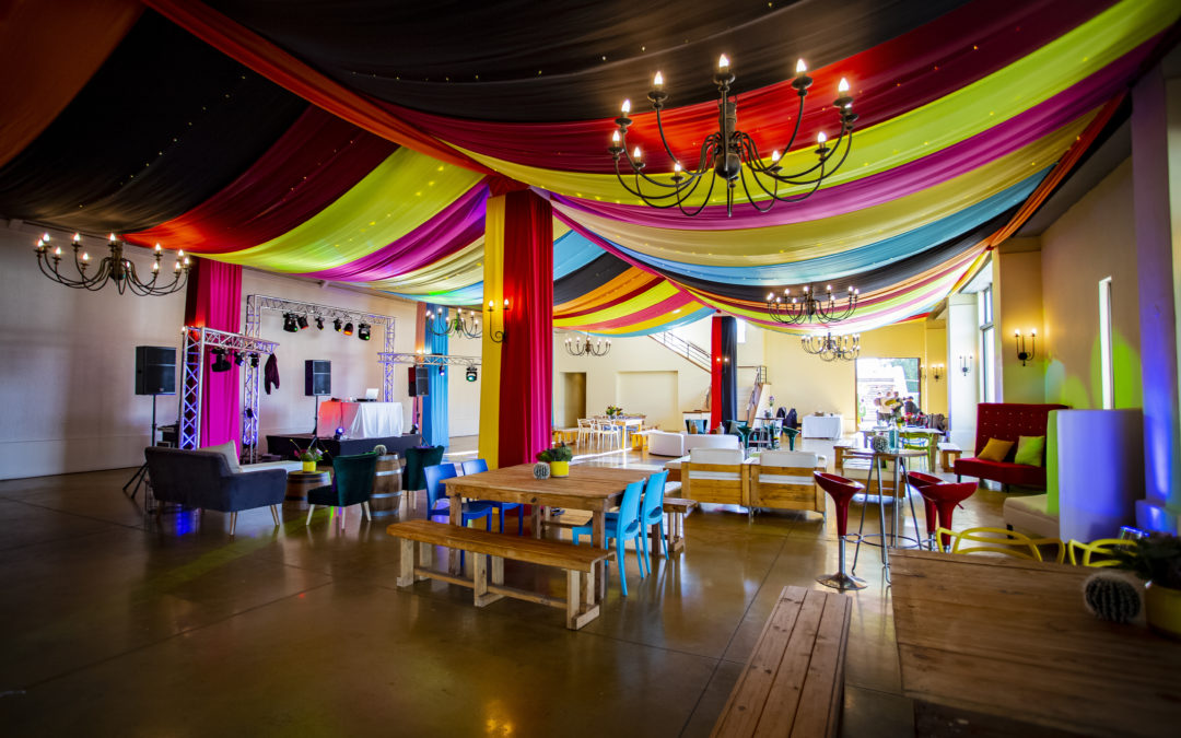 Corporate event setup at Webersburg Wine Estate, Cape Winelands, featuring colourful draping by The Events Draping Co.