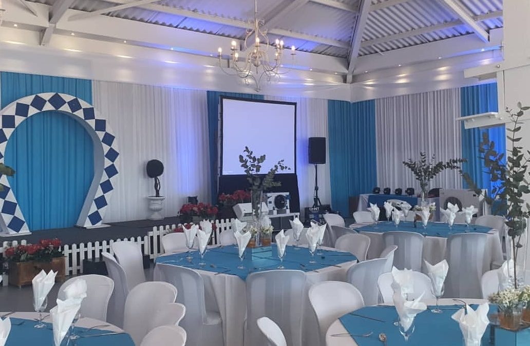 Corporate event setup with blue and white draping by The Events Draping Co.