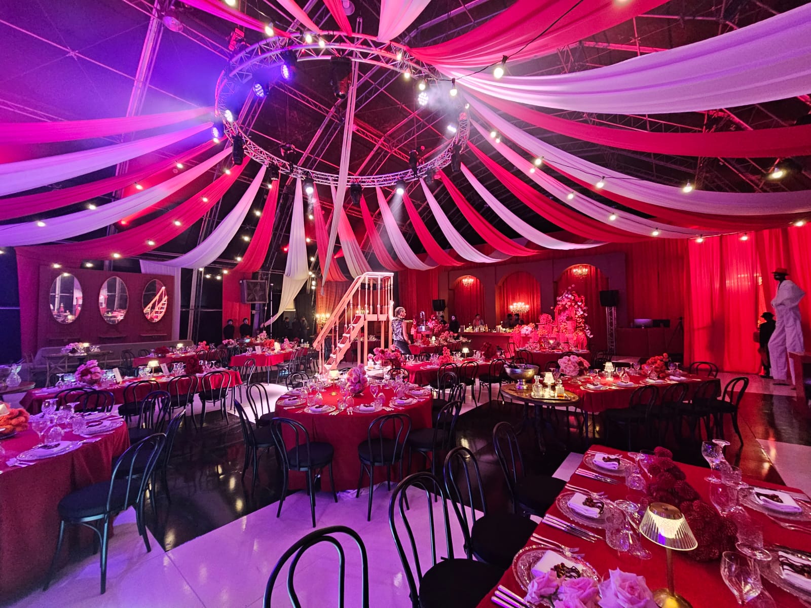 Red and white radiating ceiling strips in large marquee for a corporate event by The Events Draping Co.