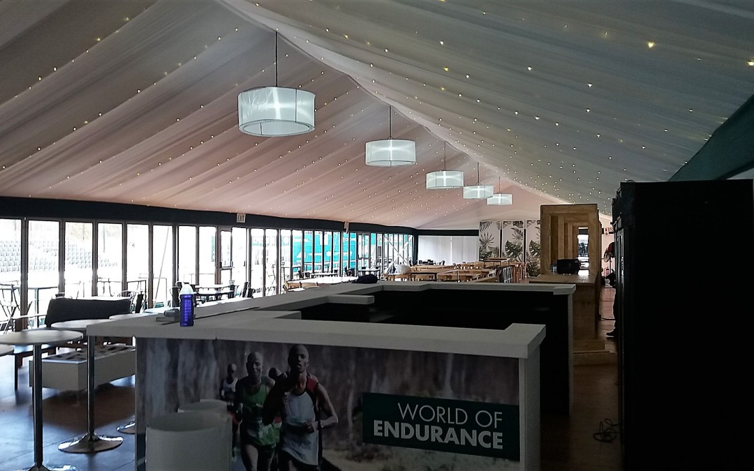VIP marquee setup for the 2017 Two Oceans Marathon at University of Cape Town, featuring white draping and fairy lights by The Events Draping Co.